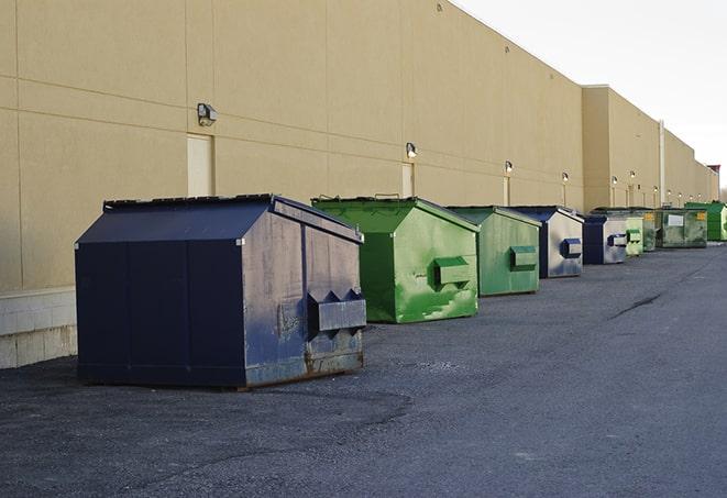 a series of colorful, utilitarian dumpsters deployed in a construction site in Arcadia, SC